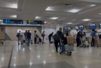 Caption: Arsip - Aktifitas di area check in Bandara SMB II Palembang. Foto: Tia