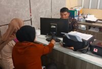 Foto korban membuat laporan polisi