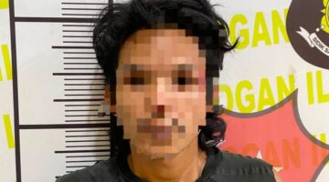 Pelaku saat diamankan polisi.
