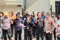 Foto Panitera PN Palembang, Dr. Sumargi, SH, MH saat melaksanakan Eksekusi kamis (17/9/2026)
