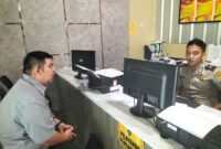 Foto korban membuat laporan polisi