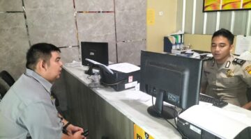 Foto korban membuat laporan polisi